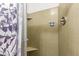 Clean bathroom with tiled shower and corner shelves at 4227 W Hatcher Rd, Phoenix, AZ 85051
