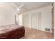 Spacious bedroom with double closets and tiled floors at 4227 W Hatcher Rd, Phoenix, AZ 85051