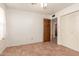 Bright bedroom with tile flooring, double closet, and ceiling fan at 4227 W Hatcher Rd, Phoenix, AZ 85051