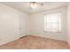 Simple bedroom featuring tile floors and a ceiling fan at 4227 W Hatcher Rd, Phoenix, AZ 85051