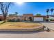 Ranch style home with a two-car garage and well-maintained lawn at 4227 W Hatcher Rd, Phoenix, AZ 85051