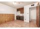 Galley kitchen with wood cabinets and tile floor at 4227 W Hatcher Rd, Phoenix, AZ 85051