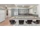 Modern kitchen with gray cabinets and breakfast bar at 4227 W Hatcher Rd, Phoenix, AZ 85051