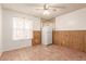 Small kitchenette with wood paneling and refrigerator at 4227 W Hatcher Rd, Phoenix, AZ 85051