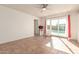 Living room with tile floor, sliding door to pool, and ceiling fan at 4227 W Hatcher Rd, Phoenix, AZ 85051