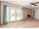 Living room with fireplace, tile floor and French doors to patio at 4227 W Hatcher Rd, Phoenix, AZ 85051
