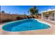 Inviting kidney-shaped swimming pool in backyard at 4227 W Hatcher Rd, Phoenix, AZ 85051
