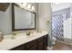 Bathroom with ample countertop space, modern fixtures, and a shower and tub combo at 5332 E Michelle Dr, Scottsdale, AZ 85254