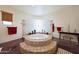 Spa-like bathroom with a large soaking tub and glass block feature wall at 5827 N 129Th Ave, Litchfield Park, AZ 85340