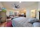 King-size bed in large bedroom with attached kitchen at 5827 N 129Th Ave, Litchfield Park, AZ 85340