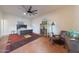Bright bedroom featuring a king-size bed and ceiling fan at 5827 N 129Th Ave, Litchfield Park, AZ 85340