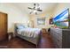 Bedroom with large TV and ceiling fan at 5827 N 129Th Ave, Litchfield Park, AZ 85340