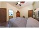 Bedroom with ensuite bathroom access and ceiling fan at 5827 N 129Th Ave, Litchfield Park, AZ 85340