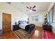 Bright bedroom with wood floors and ceiling fan at 5827 N 129Th Ave, Litchfield Park, AZ 85340