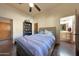 Bedroom with ensuite bathroom and ceiling fan at 5827 N 129Th Ave, Litchfield Park, AZ 85340
