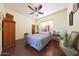 Cozy bedroom with wood floors and ceiling fan at 5827 N 129Th Ave, Litchfield Park, AZ 85340