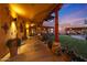 Long covered patio with terracotta pots and beautiful landscaping at 5827 N 129Th Ave, Litchfield Park, AZ 85340