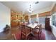 Open dining area with wood table and rug, adjacent to the kitchen at 5827 N 129Th Ave, Litchfield Park, AZ 85340