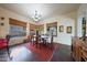 Charming dining room with wood table, chandelier, and access to the patio at 5827 N 129Th Ave, Litchfield Park, AZ 85340