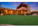 Stunning Southwestern-style home with expansive backyard, covered patio, and beautiful landscaping at 5827 N 129Th Ave, Litchfield Park, AZ 85340