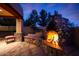 Cozy outdoor stone fireplace and seating area at 5827 N 129Th Ave, Litchfield Park, AZ 85340
