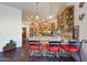 Open kitchen with breakfast bar, granite counters, and wood cabinets at 5827 N 129Th Ave, Litchfield Park, AZ 85340