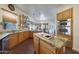 Well-equipped kitchen, granite countertops, and island with sink at 5827 N 129Th Ave, Litchfield Park, AZ 85340