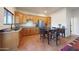 Modern kitchen featuring granite countertops and wood cabinets at 5827 N 129Th Ave, Litchfield Park, AZ 85340