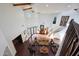 High-ceilinged living room with hardwood floors and a curved staircase at 5827 N 129Th Ave, Litchfield Park, AZ 85340