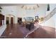 Grand living room with high ceilings, exposed beams, and a hardwood floor at 5827 N 129Th Ave, Litchfield Park, AZ 85340