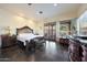 Bright and spacious main bedroom with a king-size bed and private access to the patio at 5827 N 129Th Ave, Litchfield Park, AZ 85340