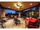 Covered patio with seating and ceiling fan at 5827 N 129Th Ave, Litchfield Park, AZ 85340
