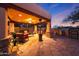 Outdoor patio with fireplace, seating, and grill at 5827 N 129Th Ave, Litchfield Park, AZ 85340