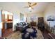Relaxing sitting area with leather sofa, massage chair, and area rug at 5827 N 129Th Ave, Litchfield Park, AZ 85340
