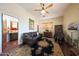 Sitting area with leather sofa and view into adjacent room at 5827 N 129Th Ave, Litchfield Park, AZ 85340