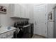 Laundry room with washer, dryer, and cabinets at 5857 E Night Glow Cir, Scottsdale, AZ 85266