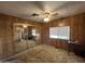 Bedroom with mirrored closet doors and window at 6960 W Peoria Ave # 63, Peoria, AZ 85345