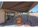 Covered patio with table and chairs, grassy yard at 7132 W Vermont Ave, Glendale, AZ 85303