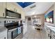 Kitchen features stainless steel appliances and an adjacent dining area at 7132 W Vermont Ave, Glendale, AZ 85303