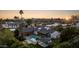 Aerial view of the house and surrounding neighborhood at sunset at 7352 E Sage Dr, Scottsdale, AZ 85250