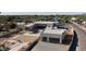 Contemporary home showcasing modern design, pool and a two-car garage at 7432 E Wethersfield Rd, Scottsdale, AZ 85260