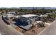 A bird's eye view of a contemporary home with fresh gray driveway at 7432 E Wethersfield Rd, Scottsdale, AZ 85260