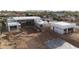 Modern home under construction site featuring pool being installed with surrounding framework, showing modern home build at 7432 E Wethersfield Rd, Scottsdale, AZ 85260