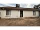 Home's backyard with large patio and gravel landscaping at 8520 W Palm Ln # 1021, Phoenix, AZ 85037