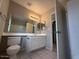 Clean bathroom with double vanity and tiled floors at 8520 W Palm Ln # 1021, Phoenix, AZ 85037