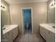 Spacious bathroom with double vanity and toilet at 8520 W Palm Ln # 1021, Phoenix, AZ 85037