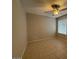 Bright bedroom with tile flooring and ceiling fan at 8520 W Palm Ln # 1021, Phoenix, AZ 85037