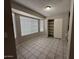 Bright dining area with large window and built-in shelving at 8520 W Palm Ln # 1021, Phoenix, AZ 85037