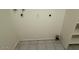 Laundry area with utility sink and storage cabinets at 8520 W Palm Ln # 1021, Phoenix, AZ 85037
