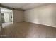 Open living area with tile floors and access to kitchen at 8520 W Palm Ln # 1021, Phoenix, AZ 85037